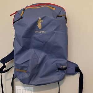 cotopaxi Allpa 35L backpack with red and yellow accents